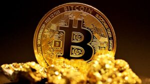 a bitcoin sitting on top of a pile of gold nuggets - A single bitcoin surrounded by raw gold pieces., tags: ether declines - unsplash
